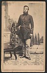 [Private Lester W. Hamilton of Co. C, 39th Illinois Infantry Regiment in uniform in front of painted backdrop showing terrace and landscape]