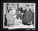 [Untitled photo shows: Mayor La Guardia swearing in Justice Myles Paige]