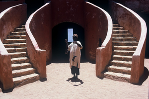 Man holding slave chains, in courtyard of the Slave House, Gorée (island), Senegal