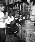 Thumbnail for A Negro doll factory in Harlem which provides colored dolls for Negro children