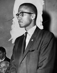 Malcolm X at meeting