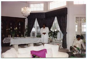 Woman Near Window and Seated Woman at Induction Ceremony