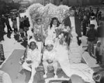 Children from the Lutheran School on a Mardi Gras float in an African American neighborhood in Mobile, Alabama.