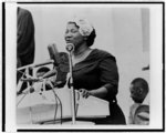 Thumbnail for [Mahalia Jackson, half-length portrait, facing left, standing at podium, singing]