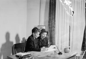 St. Paul Staff sitting at desk [from envelope?] [acetate film photonegative]