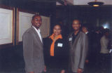 Three members of the Ethnic Alumni Association pose together at a reception honoring Father Wild, 2001