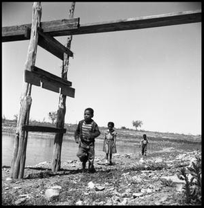 Children Running Along a Bank