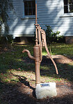 Hand pump outside the one-room St. Joseph Parish School for African-American Children at the Walter Jones Historical Park, a living-history village operated by the Mandarin Museum Historical Society in Jacksonville, Florida, in the northeastern corner of that state