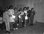 Boys and girls holding awards, Los Angeles, 1970