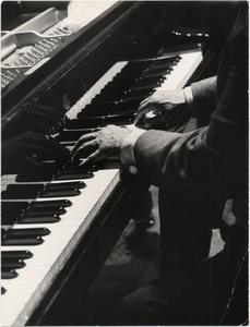 Duke Ellington's hands playing piano : black-and-white photoprint.