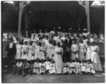 [African American children with a few adults in a pavilion]