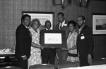 Jessie Mae Beavers and others holding a certificate, Los Angeles, 1986