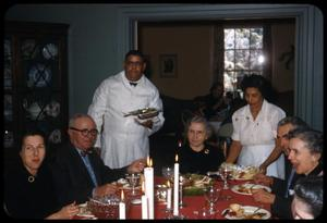 Family Being Served at Christmas Dinner Table