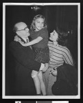 William Schneiderman greets his wife and child upon release from jail, Dec. 10, 1951, Federal Building, downtown Los Angeles