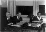 [Arthur B. Spingarn, Walter White, and Richetta G. Randolph, sitting at desk in the NAACP office, New York, N.Y.]