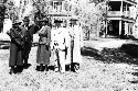 Unidentified group of people. Corinne Davis facing left. Jackson Davis in lighter colored suit. Picture sent by William W. Brierley