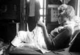 Josie Mae Jones sitting on a chair inside her home on Clayton Alley in Montgomery, Alabama.