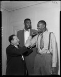 Abe Saperstein, Satch Paige, and Walter Dukes of the Harlem Globetrotters