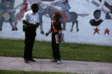 Student conversing with security guard