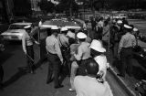 Police officers arresting young civil rights demonstrators during the Children's Crusade in Birmingham, Alabama.