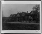 [Exterior view of houses along unpaved street in Georgia]