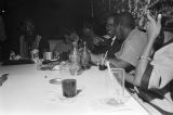 People seated at a table in a club, probably in Montgomery, Alabama.