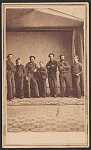 [Seven unidentified sailors in Union uniforms in studio with glass ceiling]