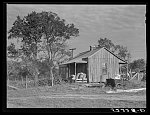 Home of Negro wagehand, Knowlton Plantation, Perthshire. On the porch are sacks of cotton. Mississippi Delta, Mississippi