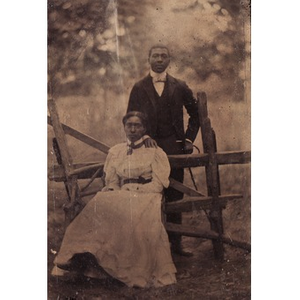 Thumbnail for An African American couple posing by a fence