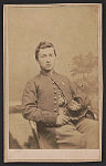 [Private William Phelps McNeil of Co. H, 2nd New York Heavy Artillery Regiment, in uniform, in front of painted backdrop]