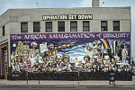 The African Amalgamation of Ubiquity, mural, substance abuse treatment center, Operation Get Down. Painted in 1985 by Curtis Lewis, the panorama represents a view of the history of black people, going back to the Egyptians, and their presence in Detroit, culminating in the portrait of Coleman Young. 9980 Gratiot Ave., Detroit 1995