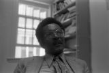 John Blassingame: New York. John Blassingame seated in office, Fredrick Douglas portrait on the wall (BLJP 1-79 #101)