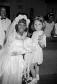 Susie Sanders Hubbard standing with a Robin Peppler in a church building in Montgomery, Alabama, after her wedding.