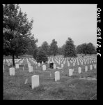 [Untitled photo, possibly related to: Arlington Cemetery, Arlington, Virginia. Decorating a soldier's grave in one of the Negro sections on Memorial Day]