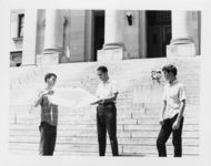 Mississippi State Sovereignty Commission photograph of Richard Barrett and an unidentified teenager holding a proclamation while another teenager looks on during a demonstration on the steps of the Mississippi State Capitol, Jackson, Mississippi, 1967 July 30