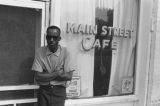 James "Son" Thomas and Joe Cooper, Leland, Mississippi. Street scene, cafe. (JTP 6-76-3)