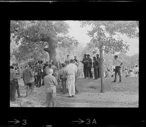 Reporters and photographers speaking to members of Black student rally in Franklin Park