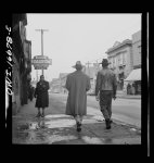 Detroit, Michigan. Back view of a Negro dressed in a zoot suit, walking in the business district