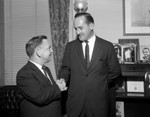 Rep Rees and Rep Albert shaking hands in Congressional Office in D.C