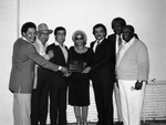 Renaldo Rey, George Kirby and others pose at the Pied Piper Club, Los Angeles, 1984