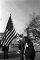 Thumbnail for Man carrying an American flag during the 20th anniversary reenactment of the Selma to Montgomery March in Selma, Alabama.