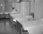 Woman making up a bed at the Jefferson County Tuberculosis Sanatorium on Ridgeway Drive in Birmingham, Alabama.