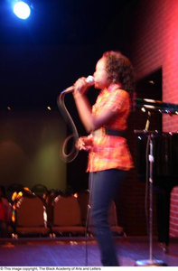 Kirondria Woods singing on stage