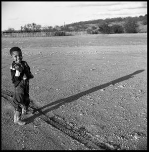 One of Oliver Jacobs' Grandchildren Smiling on a Ranch Lot