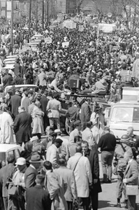 Marchers, journalists, and law enforcement officers gathering in Selma, Alabama, probably on Sylvan Street, at the start of the Selma to Montgomery March.