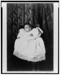 [African American baby, full-length portrait, wearing christening gown]