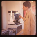 Jackie demonstrating Polaroid ID system, Anderson Gallery, January 1968