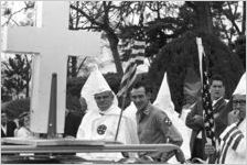 Klansmen holding American flags at a Ku Klux Klan rally in Montgomery, Alabama.