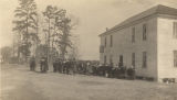 African American students assembled outside a rural school building in Evergreen, Alabama.