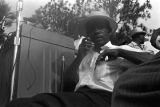 James Meredith seated beside the podium during the rally in front of the state capitol in Jackson, Mississippi, at the end of the "March Against Fear" he began on June 5.